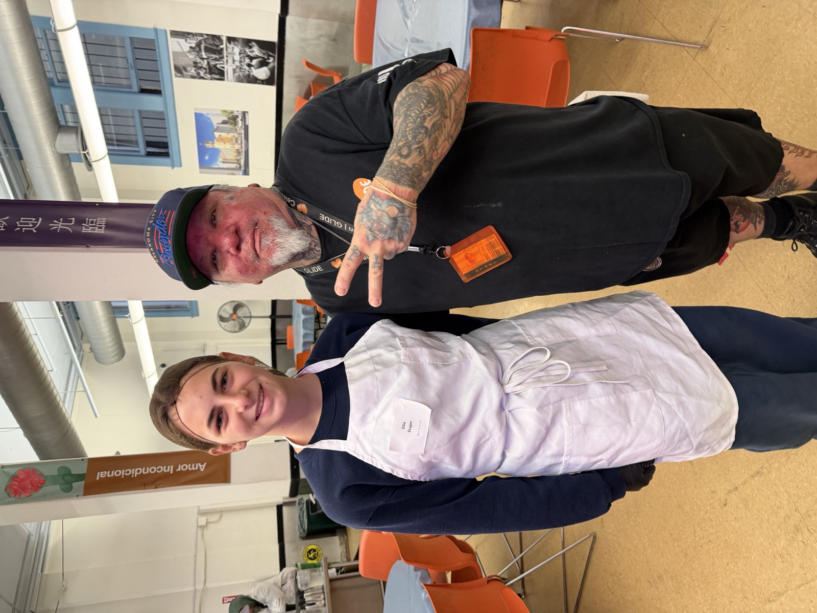 Elia volunteering with a guest at GLIDE in San Francisco